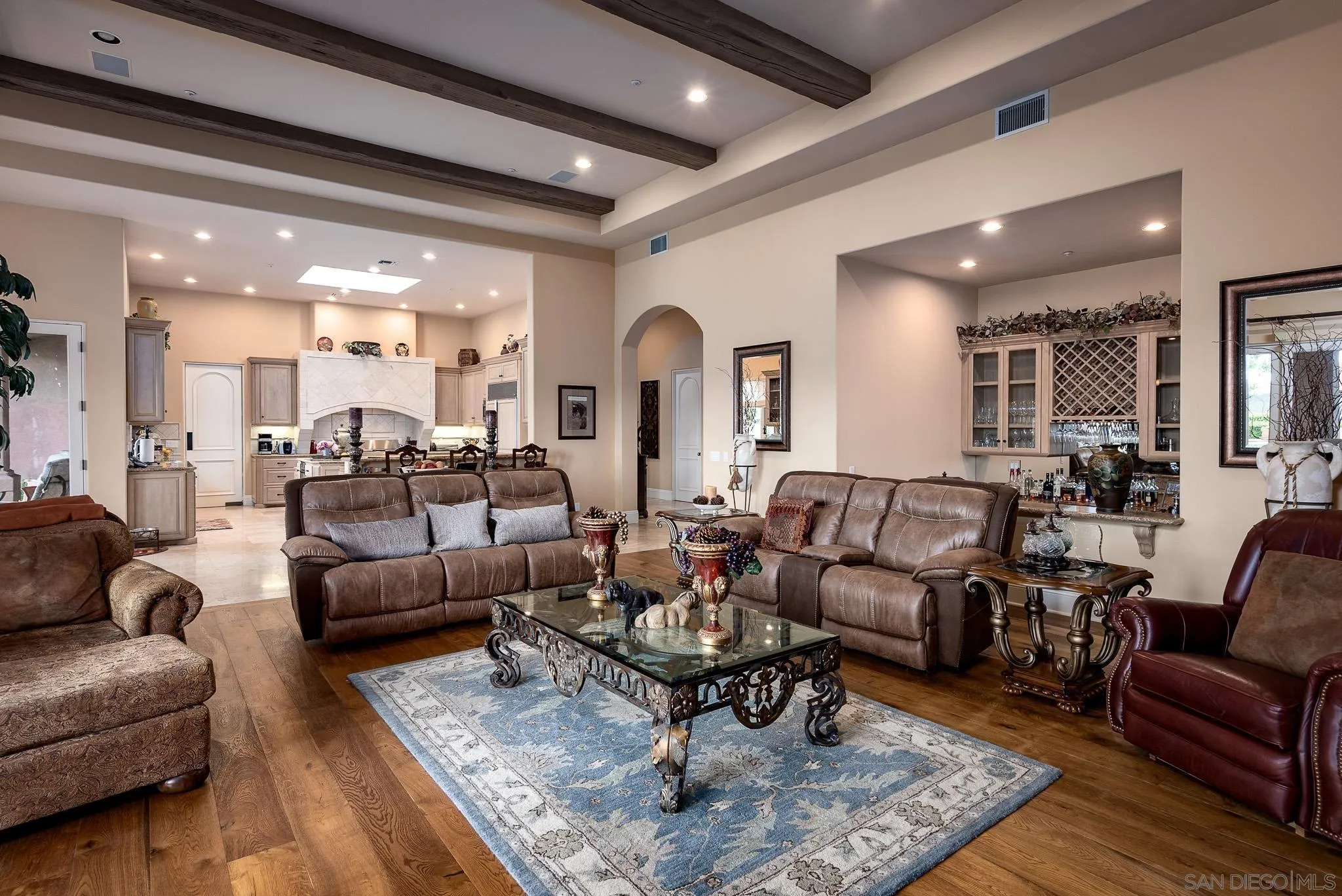 14725 Rancho Santa Fe Farms Road Rancho Santa Fe, CA 92067 - Photo 18 of 50 a living room with furniture wooden floor and a table