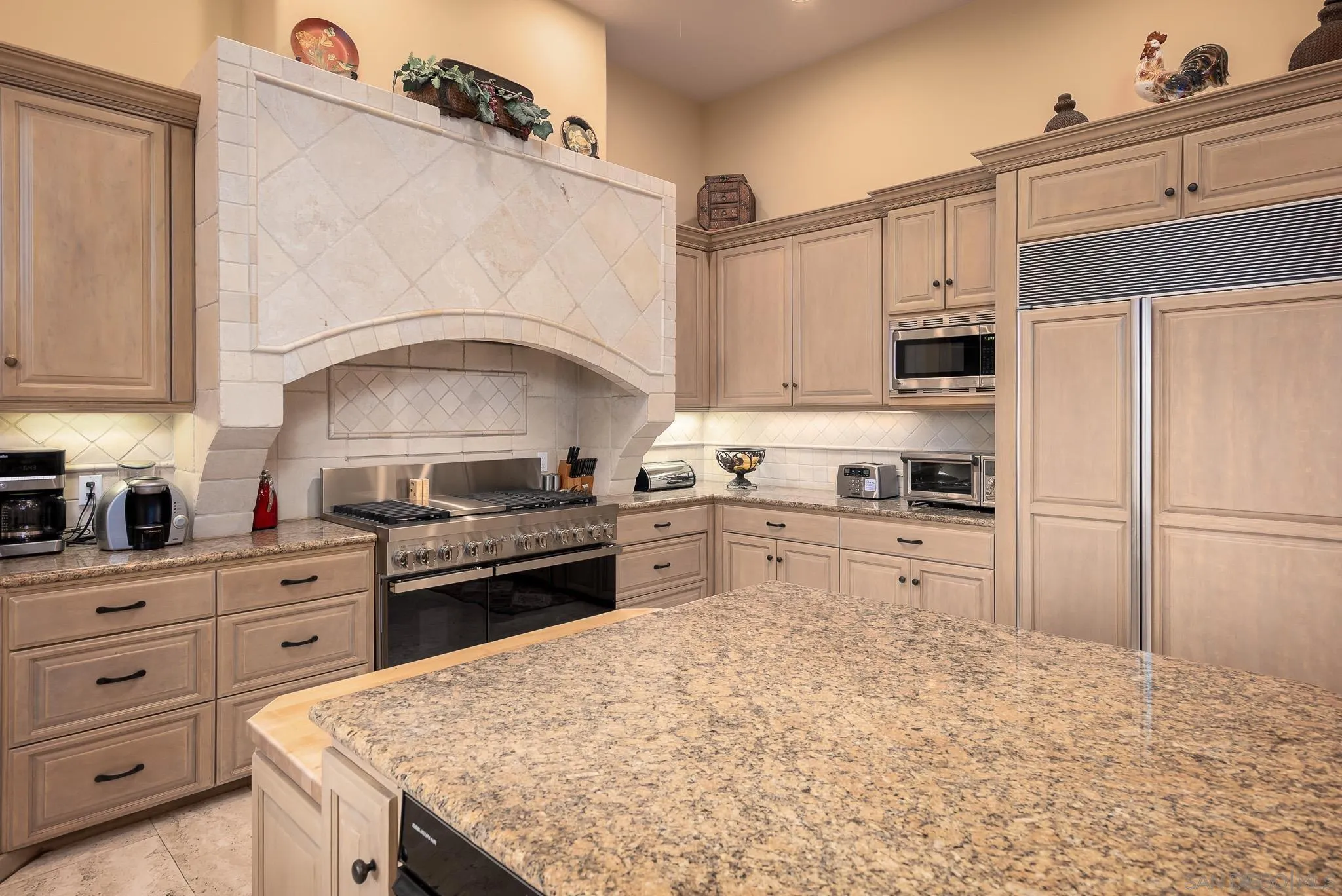 14725 Rancho Santa Fe Farms Road Rancho Santa Fe, CA 92067 - Photo 20 of 50 a kitchen with granite countertop a sink stainless steel appliances and cabinets