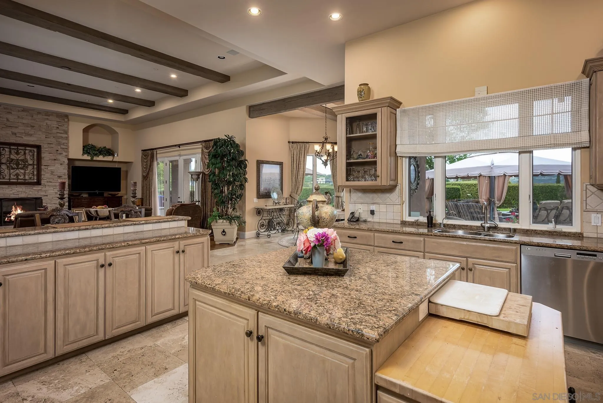 14725 Rancho Santa Fe Farms Road Rancho Santa Fe, CA 92067 - Photo 22 of 50 a kitchen with sink stove and cabinets