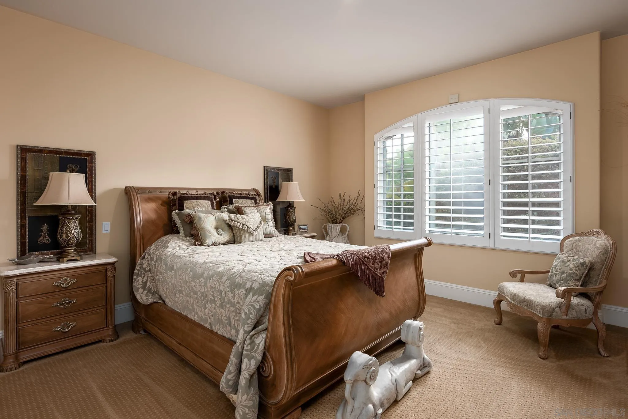 14725 Rancho Santa Fe Farms Road Rancho Santa Fe, CA 92067 - Photo 23 of 50 a bedroom with a bed and a couch