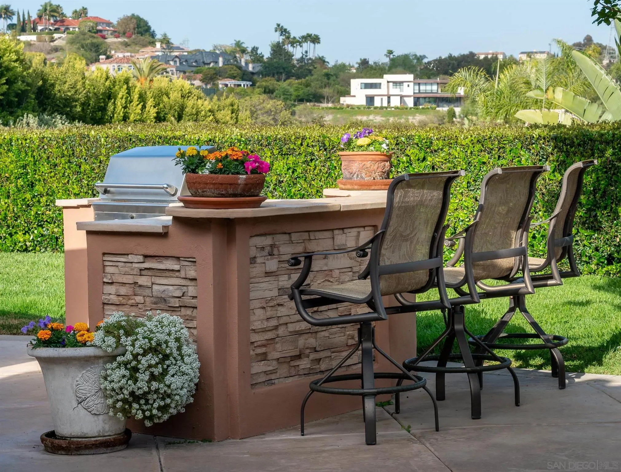 14725 Rancho Santa Fe Farms Road Rancho Santa Fe, CA 92067 - Photo 30 of 50 a view of a chairs and table in patio