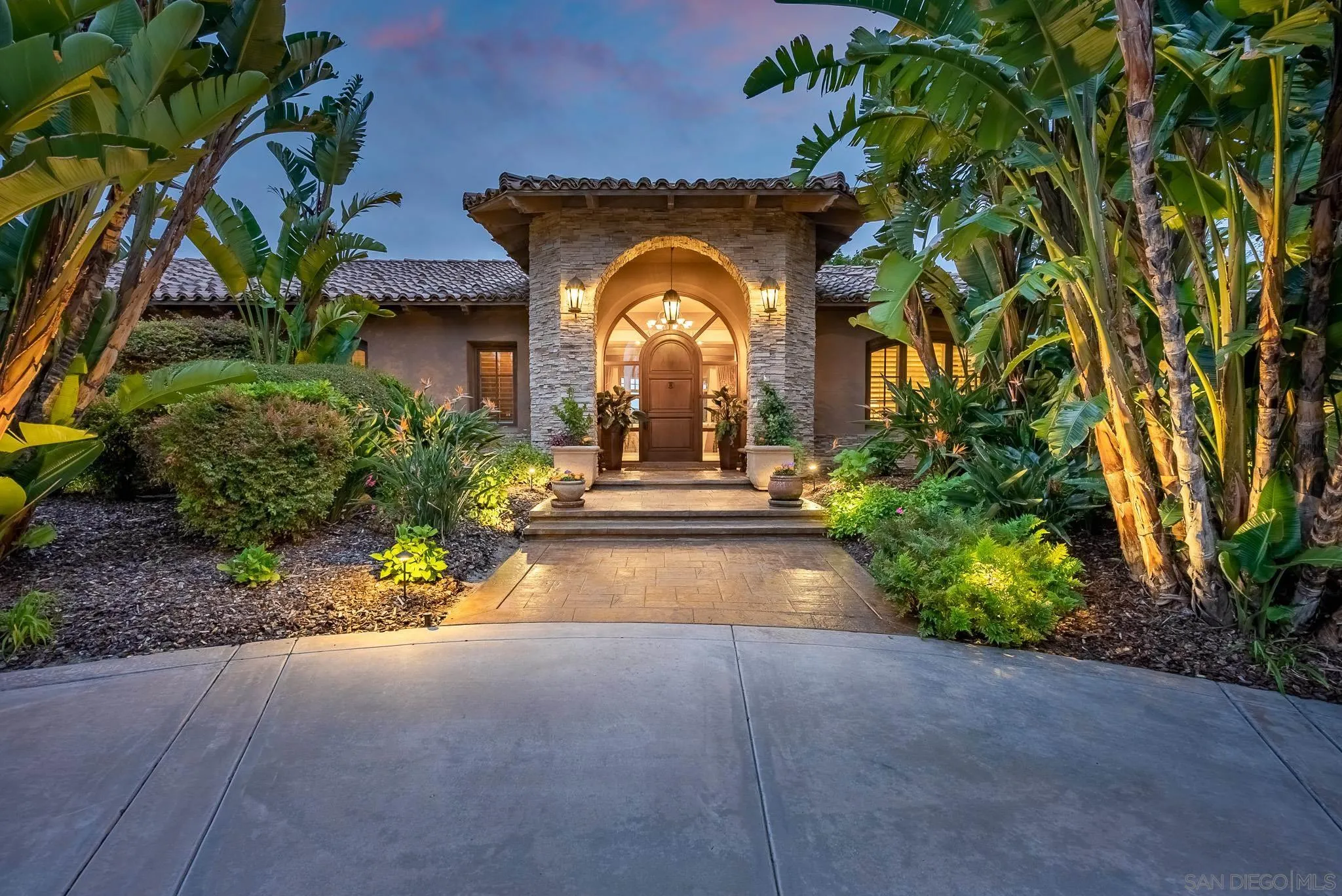 14725 Rancho Santa Fe Farms Road Rancho Santa Fe, CA 92067 - Photo 3 of 50 a view of a garden with a porch