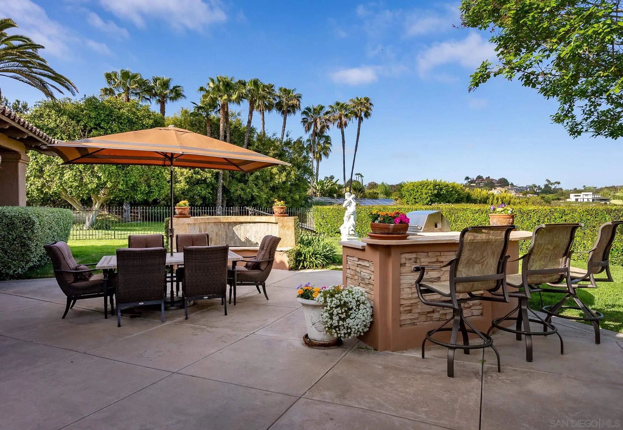 14725 Rancho Santa Fe Farms Road Rancho Santa Fe, CA 92067 - Photo 35 of 50 a view of an chairs and table in patio