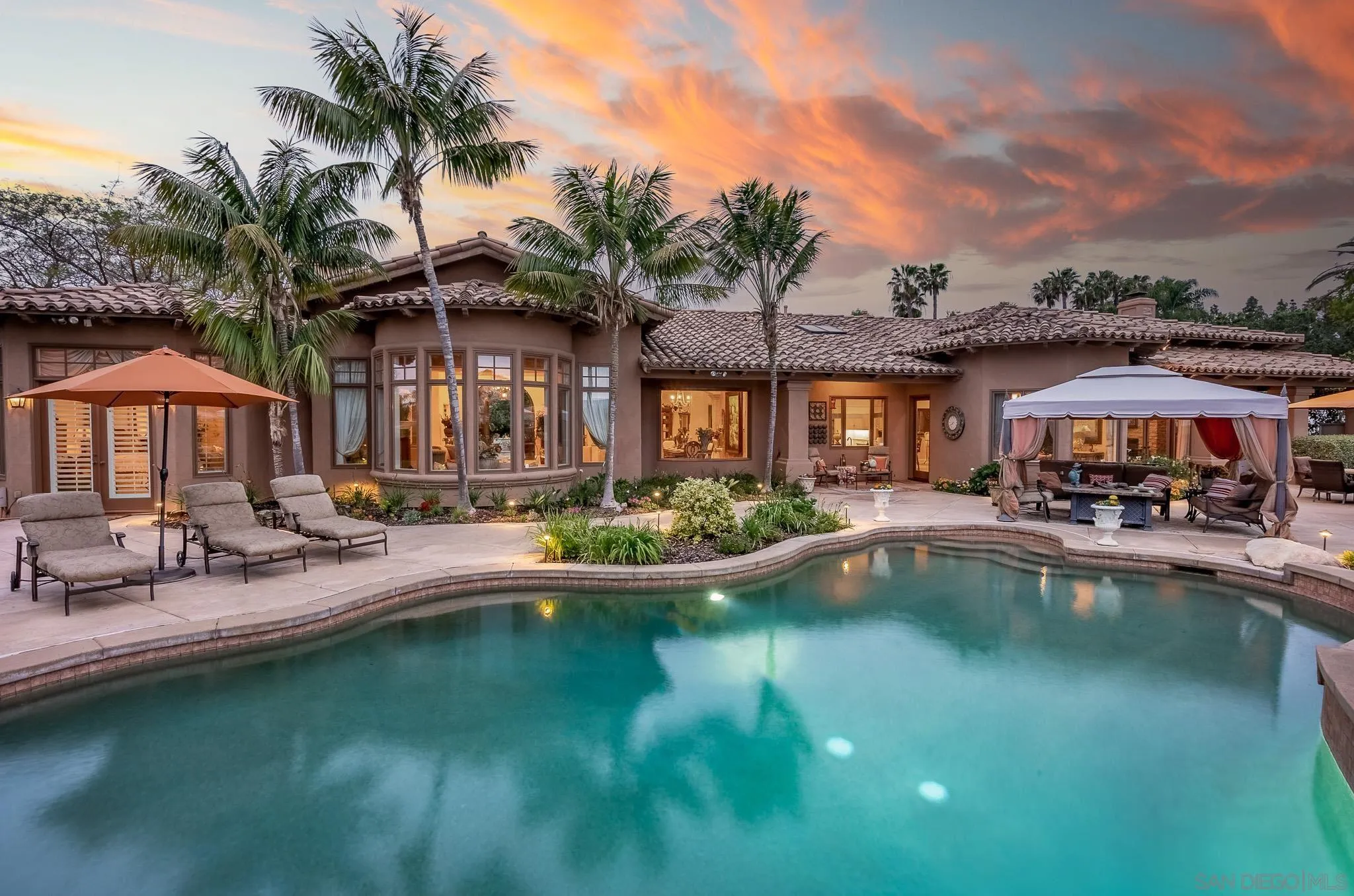 14725 Rancho Santa Fe Farms Road Rancho Santa Fe, CA 92067 - Photo 36 of 50 a front view of house with yard and outdoor seating