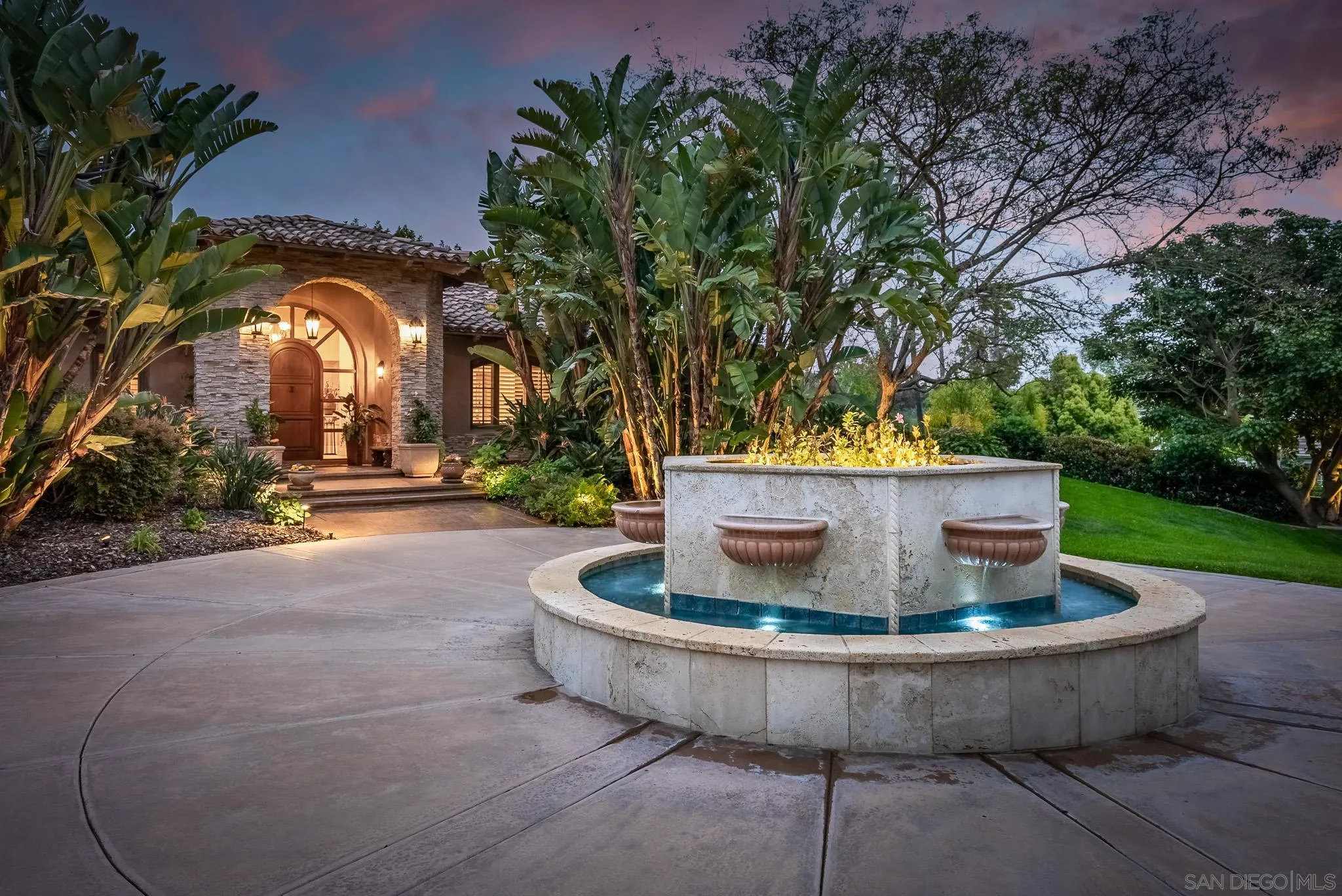 14725 Rancho Santa Fe Farms Road Rancho Santa Fe, CA 92067 - Photo 42 of 50 a view of a fountain in the backyard of house
