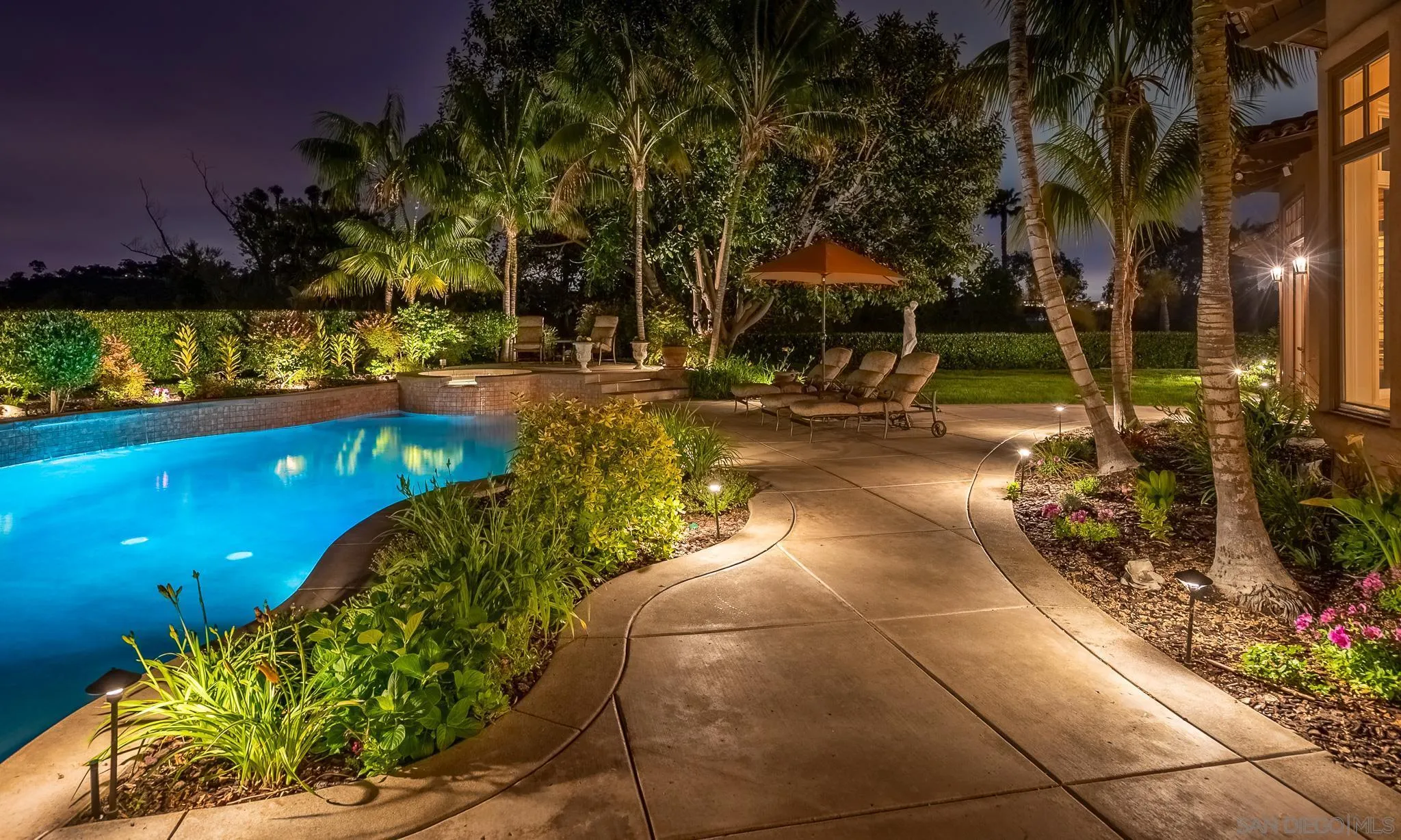 14725 Rancho Santa Fe Farms Road Rancho Santa Fe, CA 92067 - Photo 49 of 50 a view of a swimming pool with an outdoor space and seating area