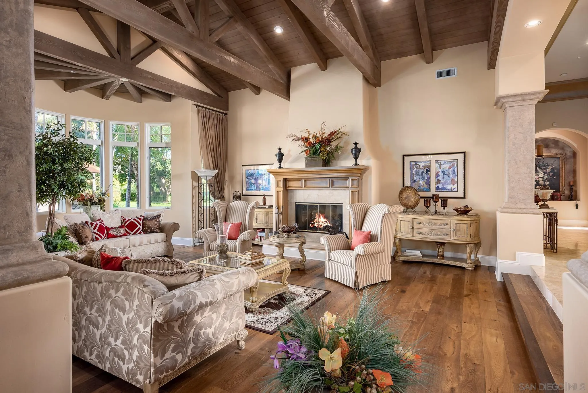 14725 Rancho Santa Fe Farms Road Rancho Santa Fe, CA 92067 - Photo 5 of 50 a living room with furniture large window and a fireplace