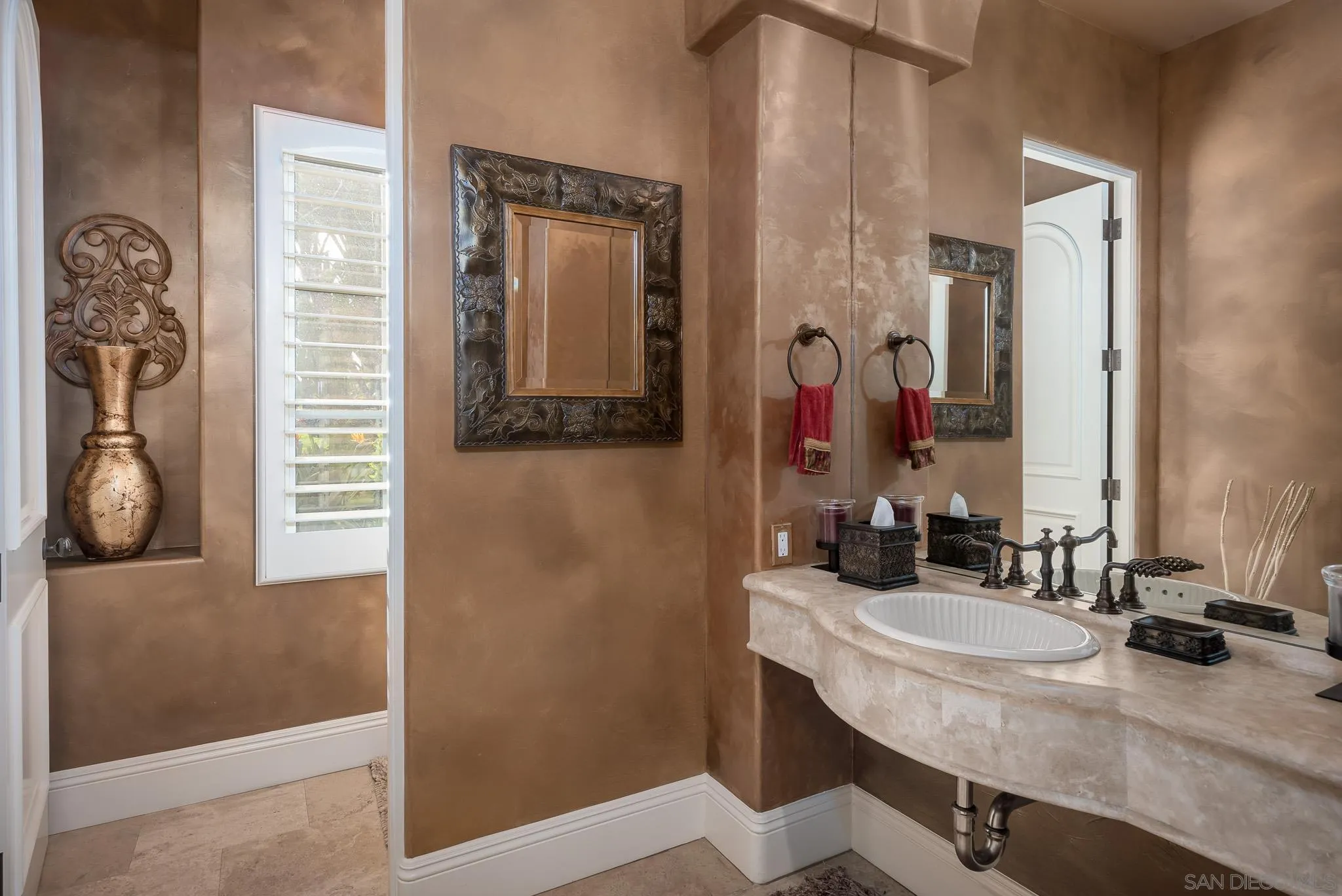14725 Rancho Santa Fe Farms Road Rancho Santa Fe, CA 92067 - Photo 8 of 50 a bathroom with a sink vanity and a mirror