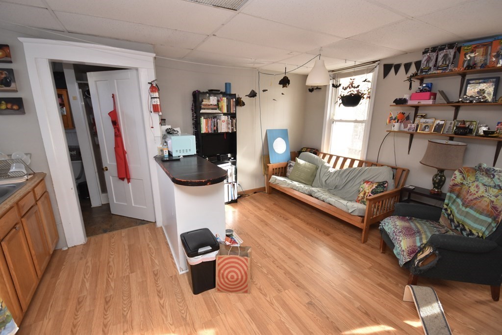 35 High Street Amherst, MA 01002 - Photo 12 of 41 a bedroom with furniture and a wooden floor
