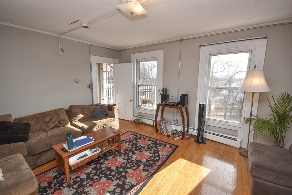 35 High Street Amherst, MA 01002 - Photo 5 of 41 a living room with furniture and a window