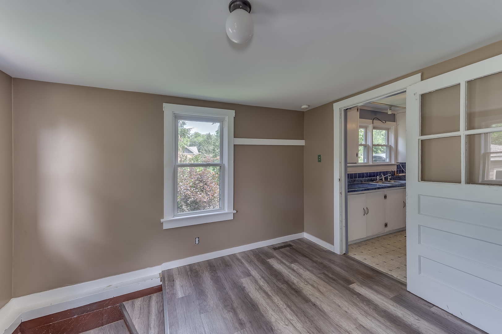 21136 Hillside Road Frankfort, IL 60423 - Photo 16 of 18 a view of an empty room with window and wooden floor