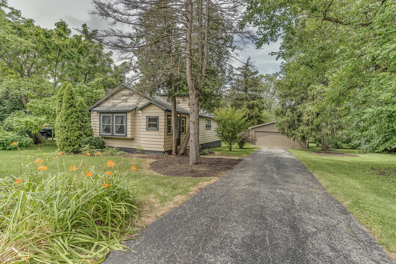21136 Hillside Road Frankfort, IL 60423 - Photo 2 of 18 a front view of a house with a yard and trees