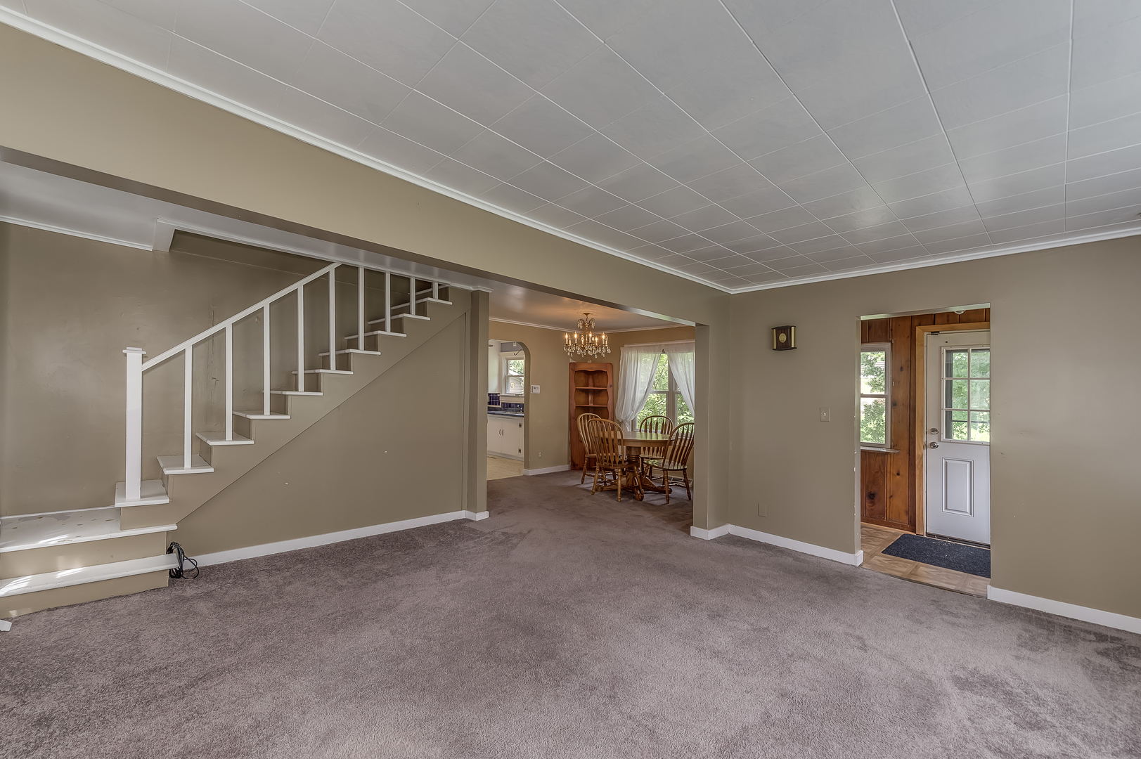 21136 Hillside Road Frankfort, IL 60423 - Photo 6 of 18 a view of an empty room with stairs and a window