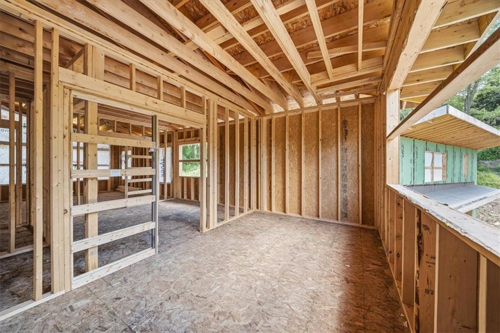 2323 Mcdevitt Road Sewickley, PA 15143 - Photo 36 of 38 a view of an empty room with wooden floor and a window