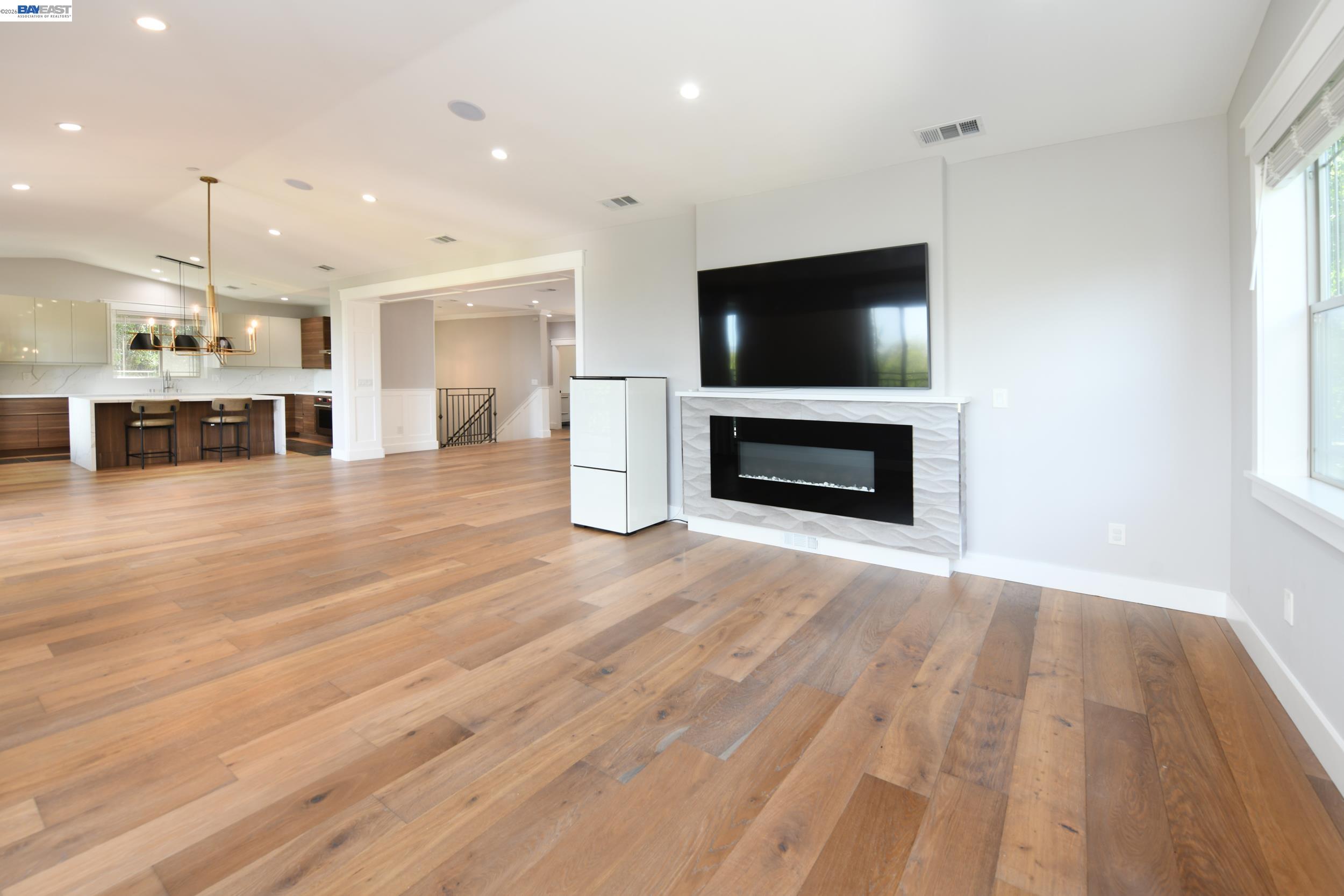 1516 Pleasant Hill Road Lafayette, CA 94549 - Photo 6 of 38 a view of a livingroom with a fireplace and a flat screen tv