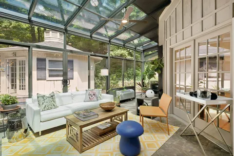 a bathroom with a toilet a sink and a mirror