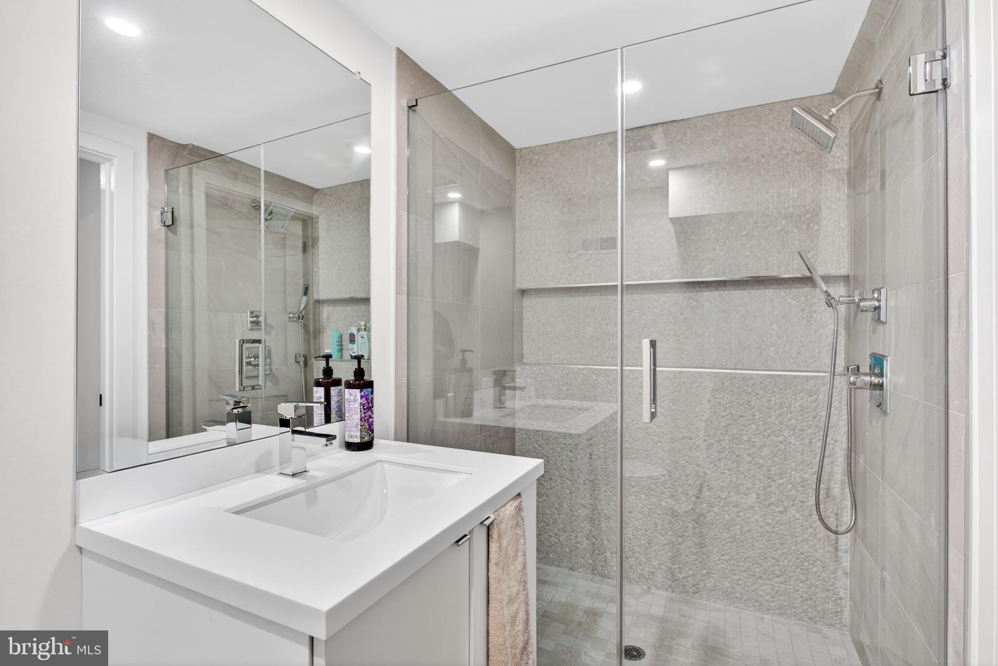 2411 Innovator Way Philadelphia, PA 19146 - Photo 22 of 26 a bathroom with a sink shower and a mirror