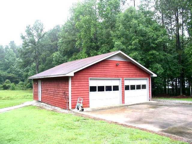 345 Turtle Creek Farm Road Apex, NC 27523 - Photo 2 of 8 2 car garage/workshop is 28 feet wide and 32 feet deep. Inside is a 13.8x8 storage room.