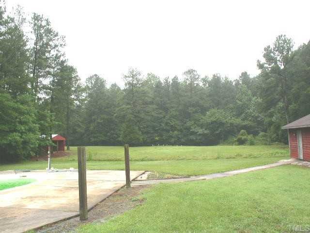 345 Turtle Creek Farm Road Apex, NC 27523 - Photo 8 of 8 Large deck overlooks pool. Hot tub sits to the right of deck.