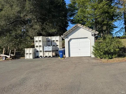 a yellow house with trees in front of it