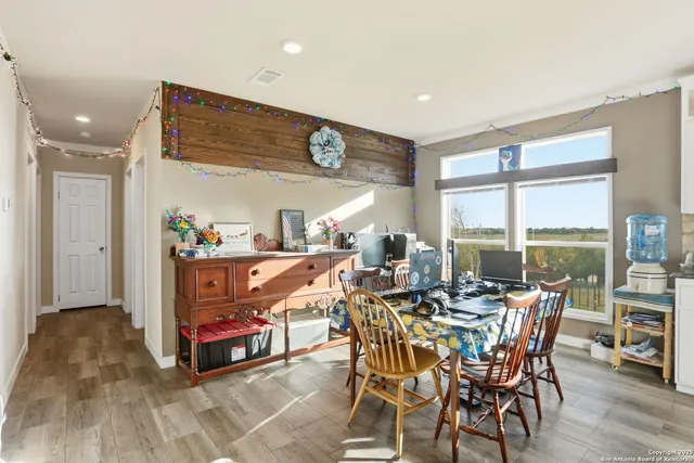 a view of a dining room with furniture window and outside view