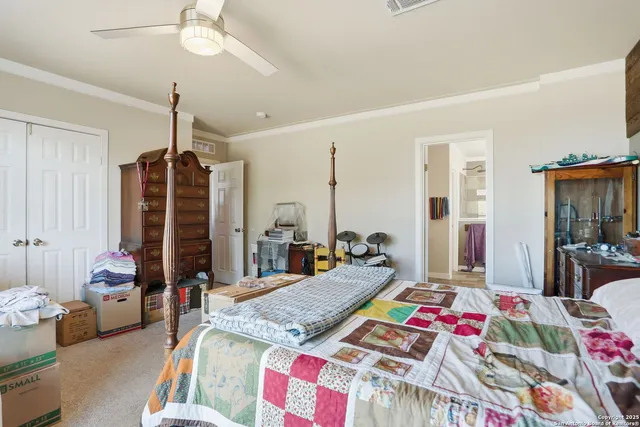 a bed room with furniture and a flat screen tv