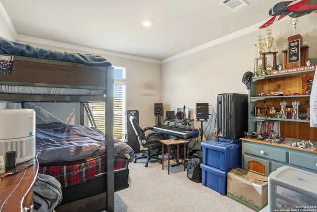 a living room with furniture a fireplace and a book shelf