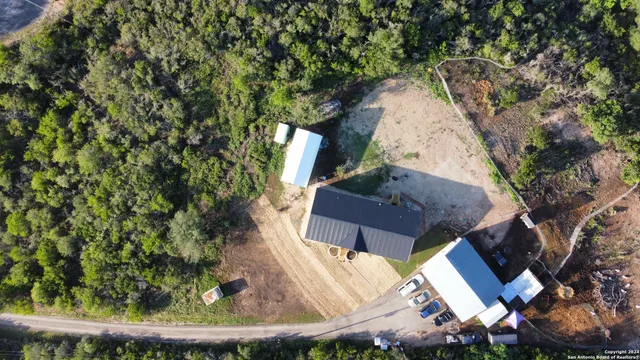 an aerial view of a house with outdoor space