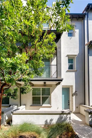 a view of house with tree in front