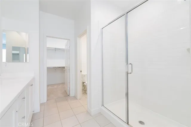 a bathroom with a shower and a sink