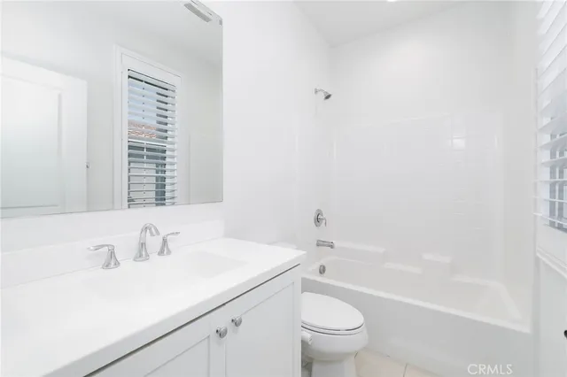 a bathroom with a sink a toilet and a bathtub