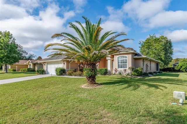 a view of house with outdoor space and garden