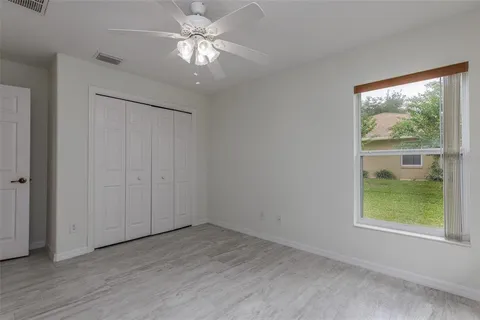 a bathroom with a granite countertop bathtub sink and mirror