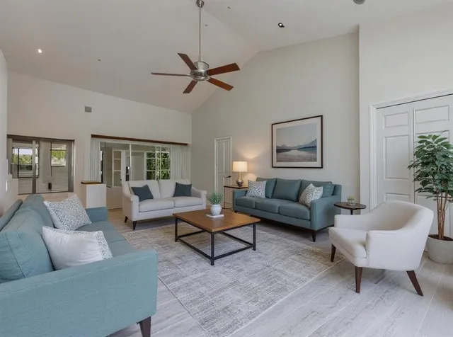 a kitchen with stainless steel appliances granite countertop a refrigerator stove and microwave