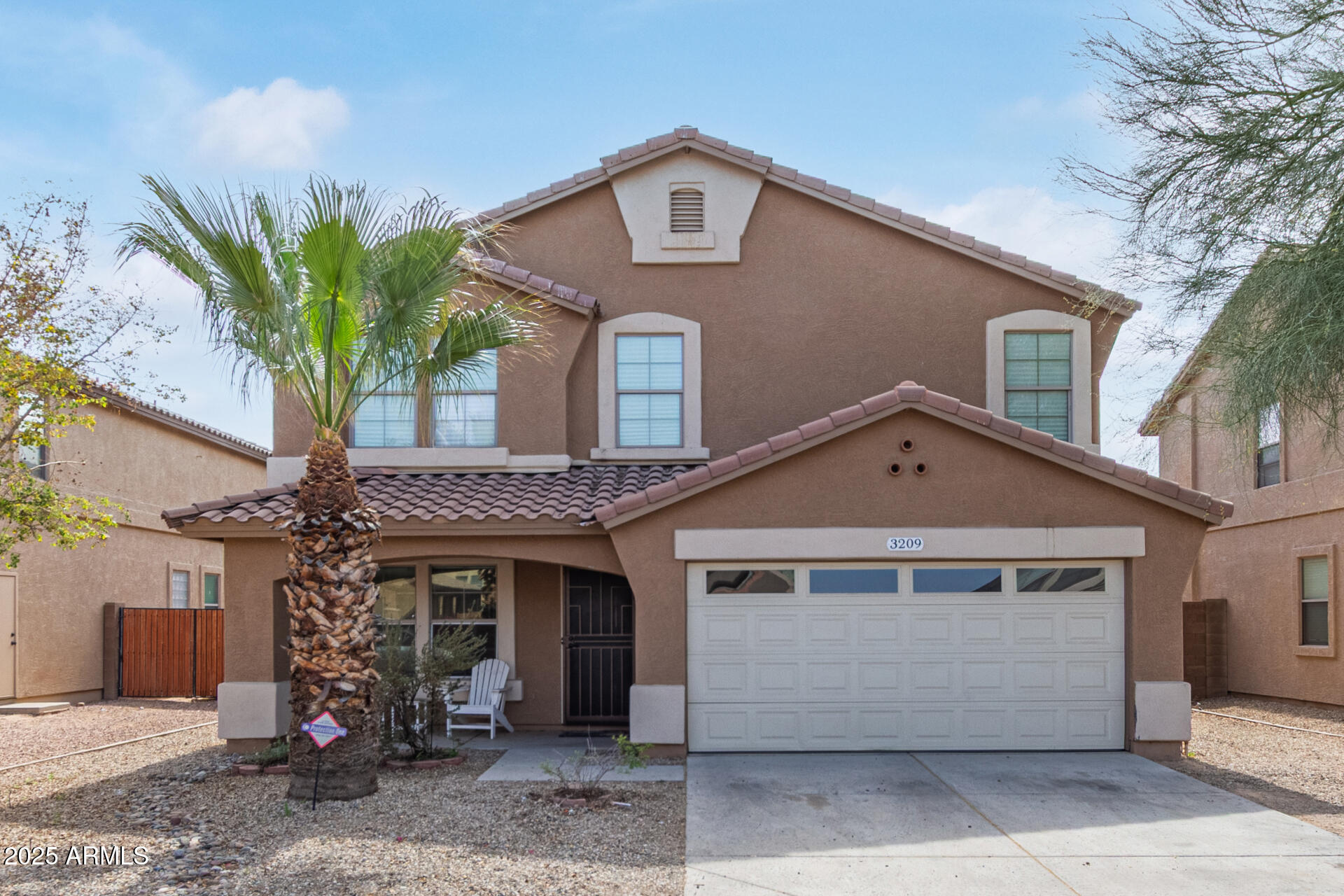 3209 West Apollo Road Phoenix, AZ 85041 - Photo 1 of 40 a front view of a house with a yard
