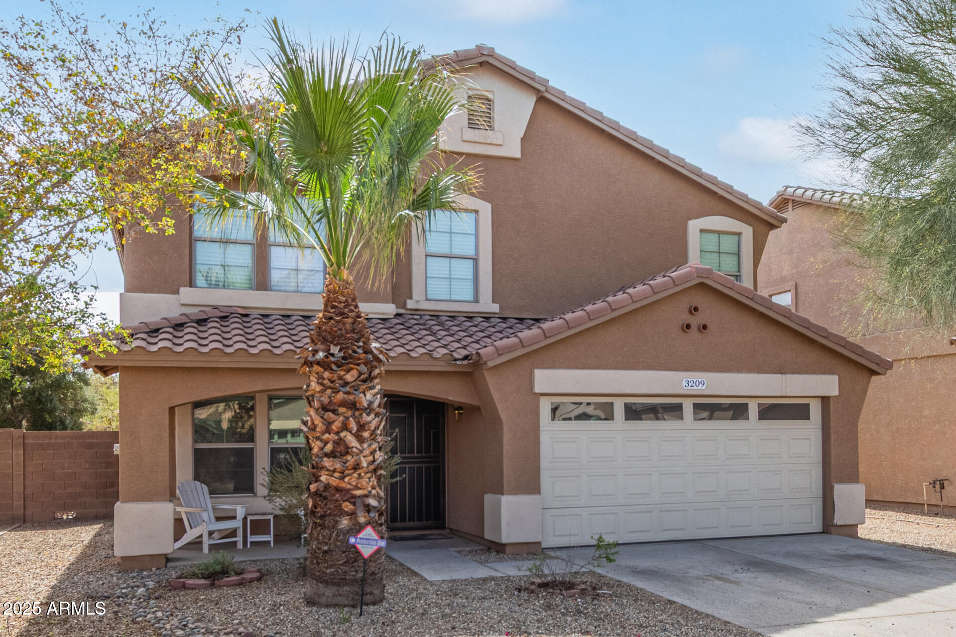 3209 West Apollo Road Phoenix, AZ 85041 - Photo 2 of 40 a front view of a house with garden