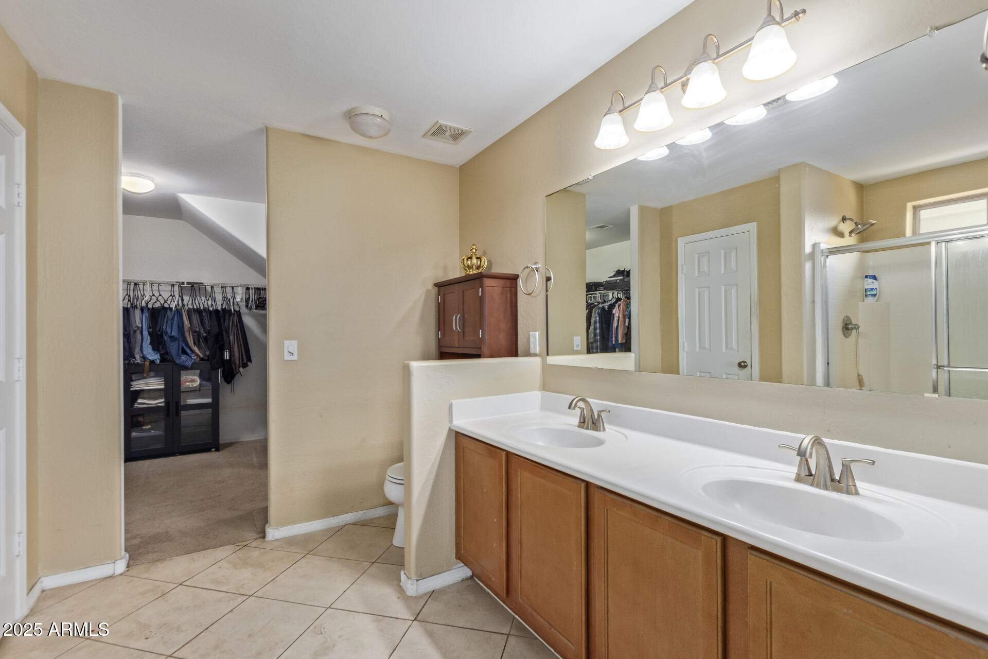 3209 West Apollo Road Phoenix, AZ 85041 - Photo 21 of 40 a spacious bathroom with a sink double vanity and a mirror