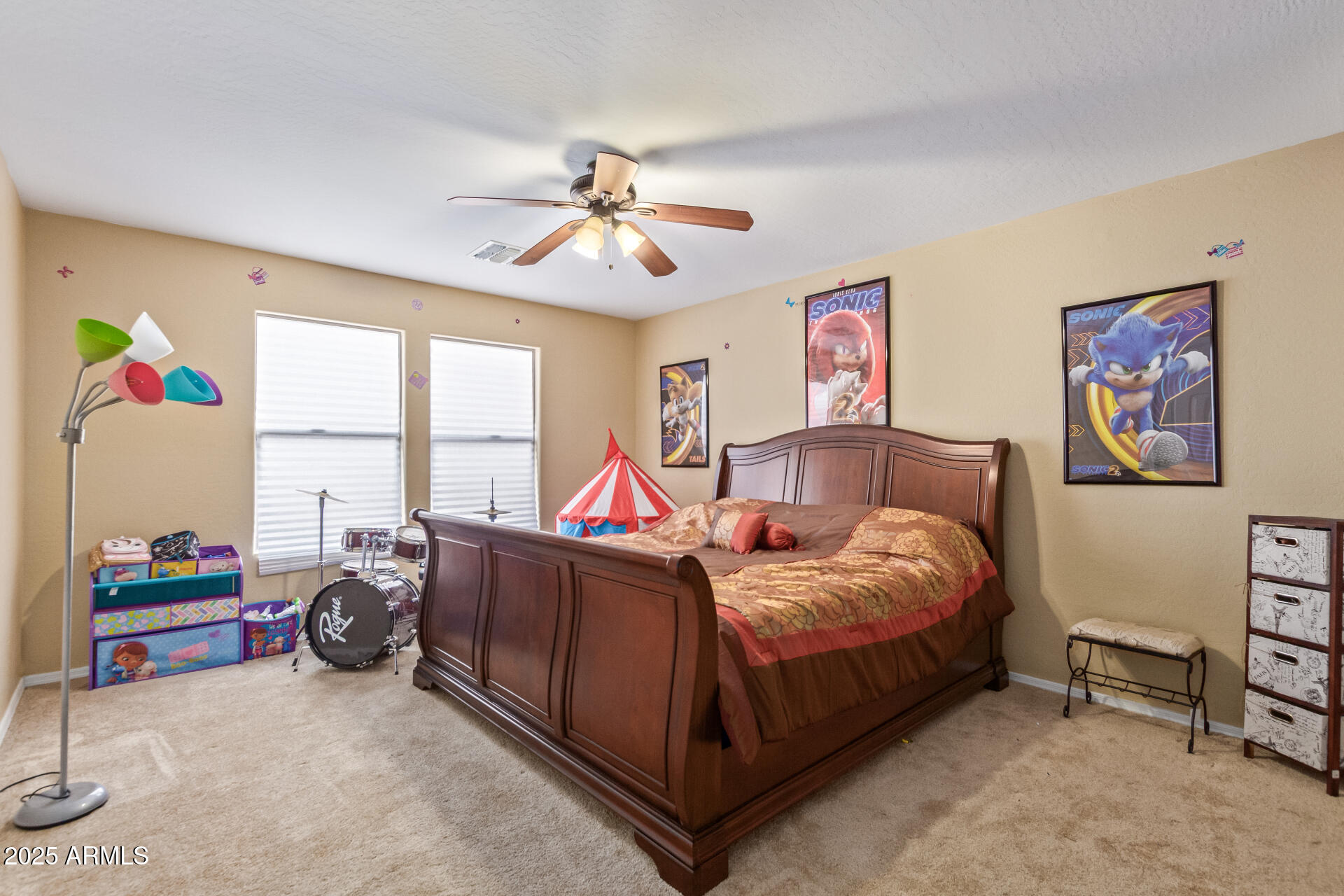 3209 West Apollo Road Phoenix, AZ 85041 - Photo 24 of 40 a bed room with a bed and a couch