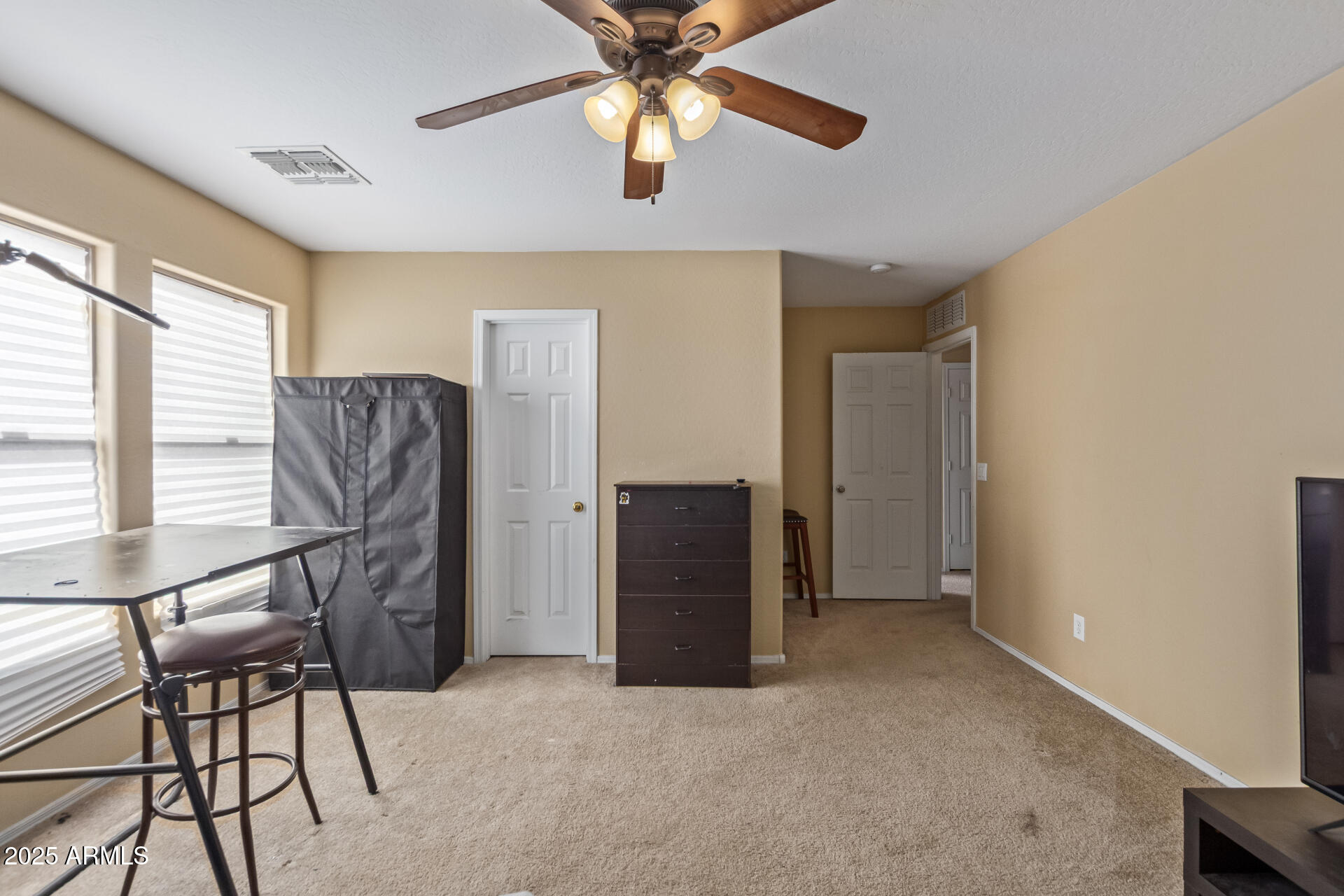 3209 West Apollo Road Phoenix, AZ 85041 - Photo 26 of 40 a view of a livingroom with furniture and a window
