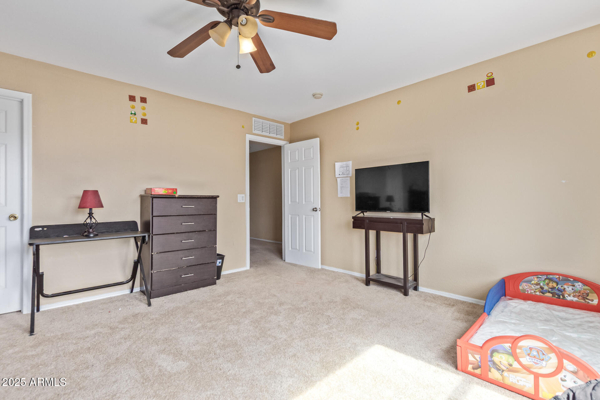 3209 West Apollo Road Phoenix, AZ 85041 - Photo 28 of 40 a living room with furniture and a flat screen tv