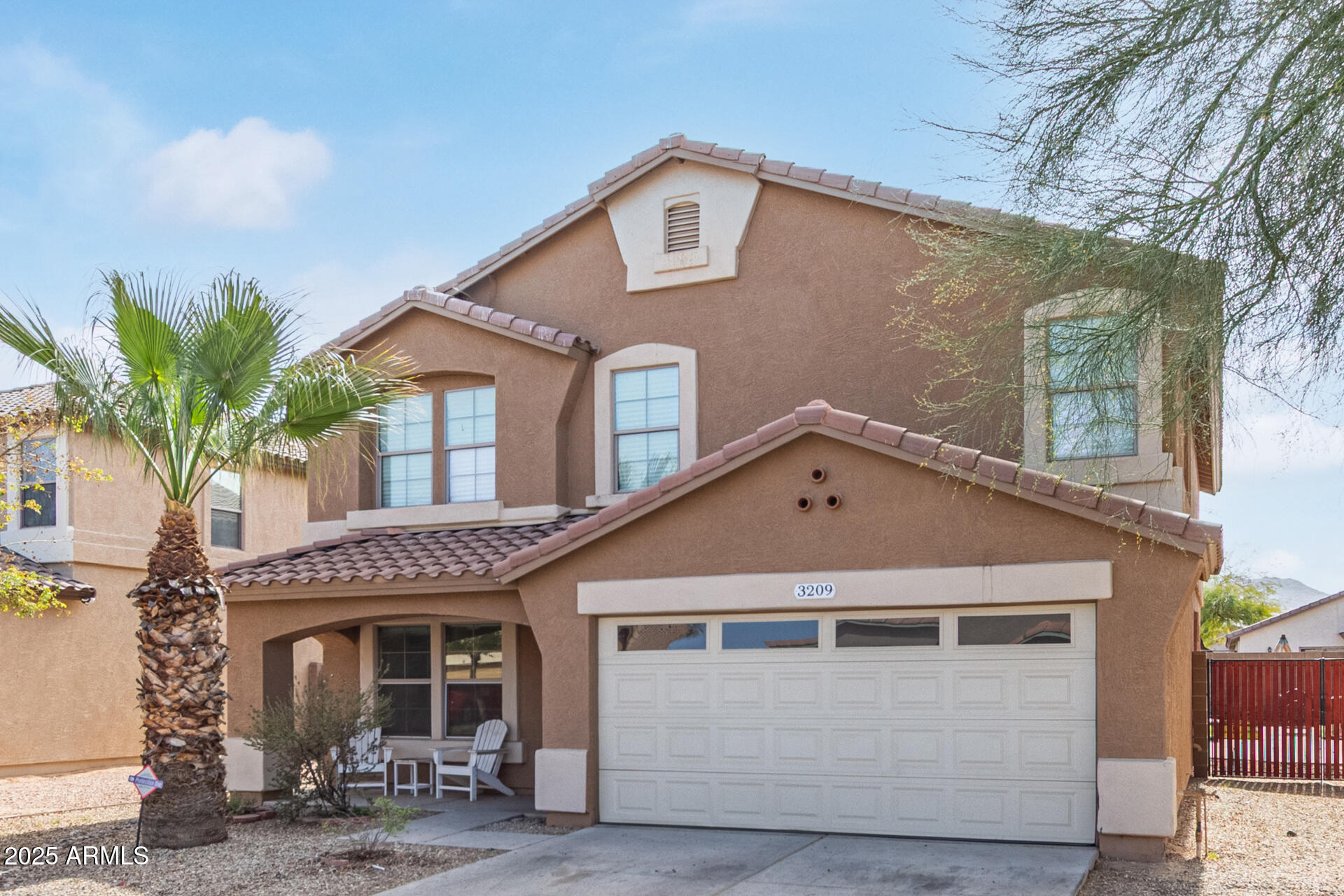 3209 West Apollo Road Phoenix, AZ 85041 - Photo 3 of 40 a front view of a house with a yard