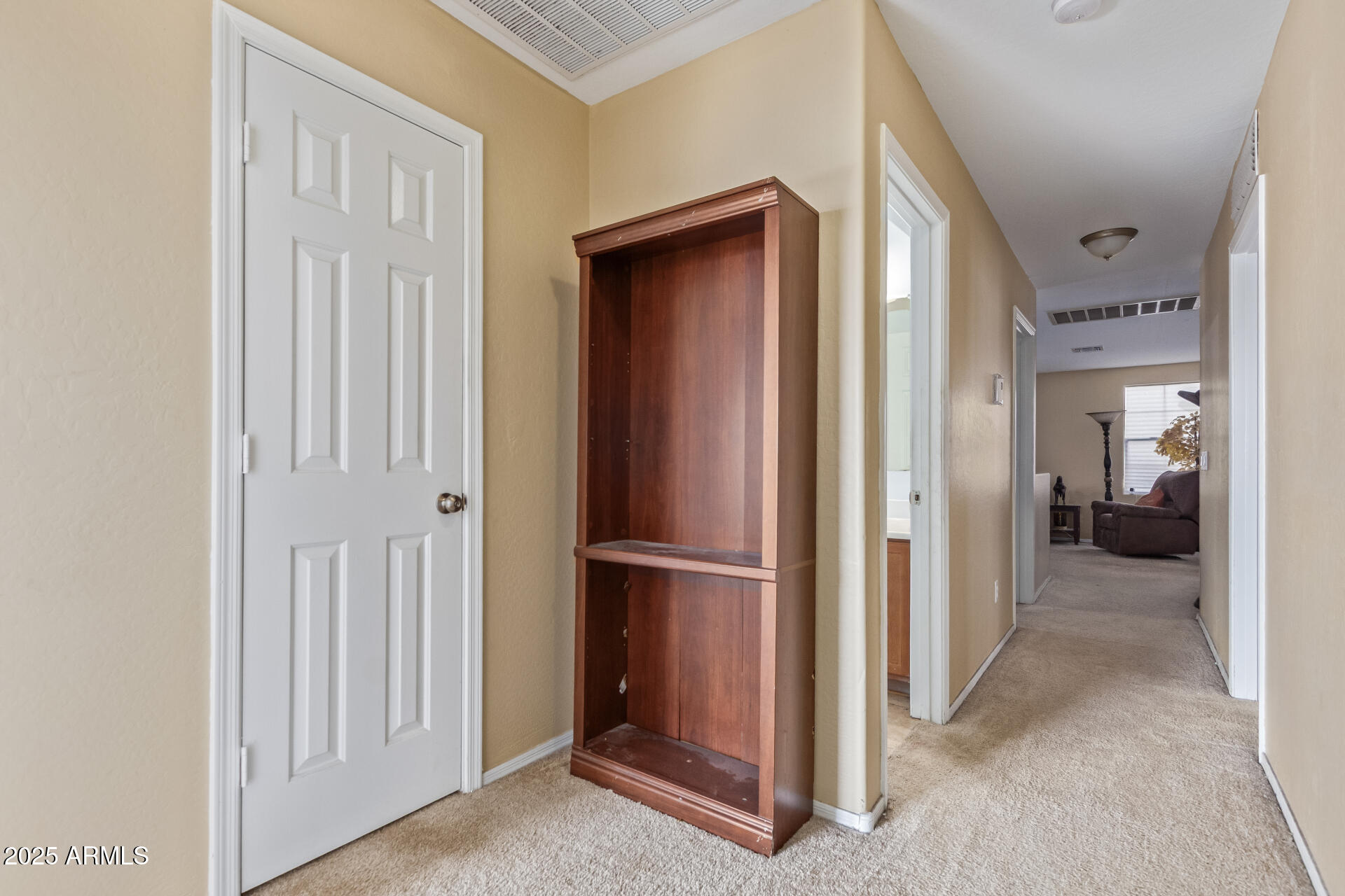 3209 West Apollo Road Phoenix, AZ 85041 - Photo 31 of 40 a view of a room that has a bed and a closet