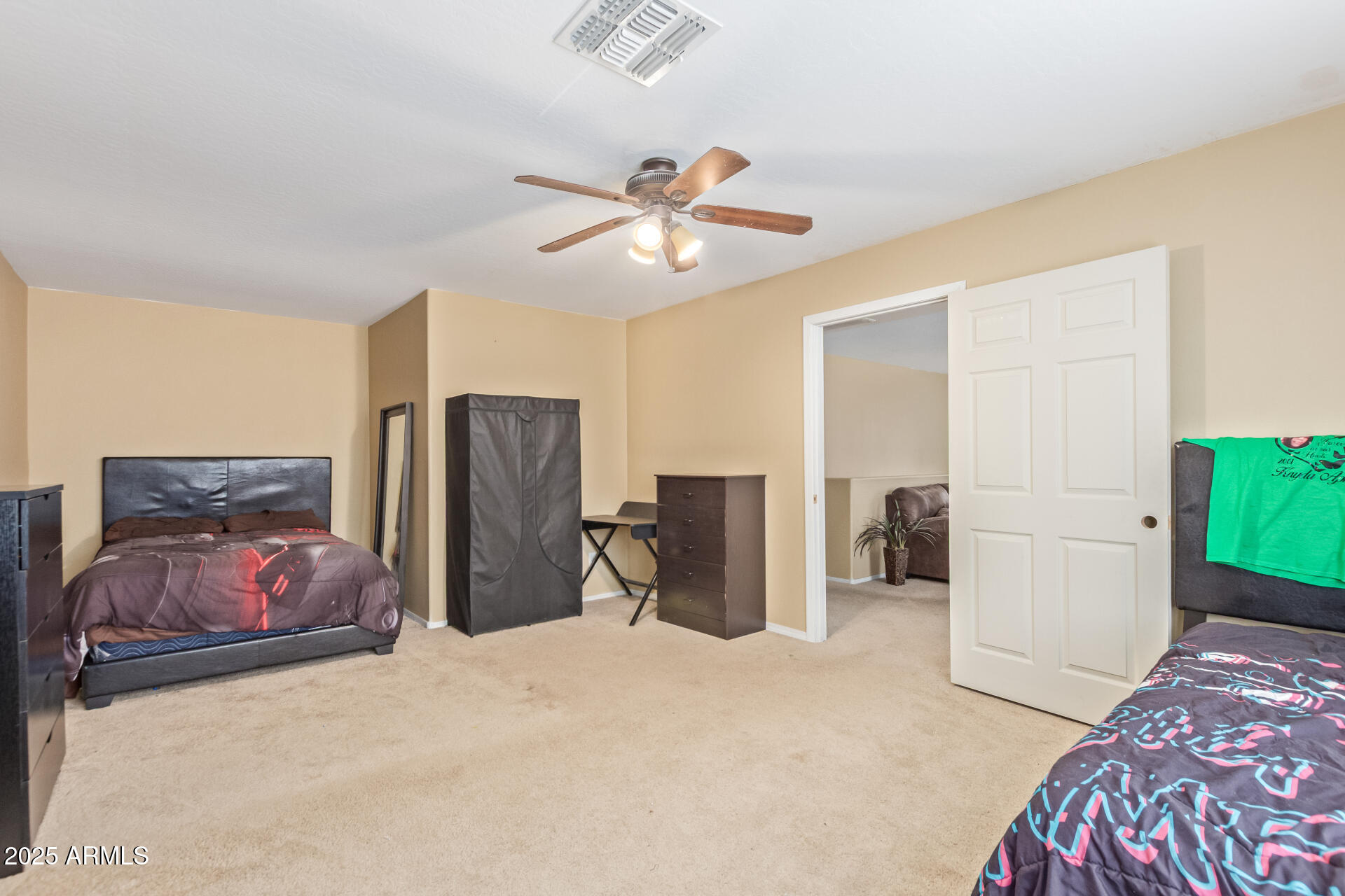 3209 West Apollo Road Phoenix, AZ 85041 - Photo 35 of 40 a bedroom with furniture and closet