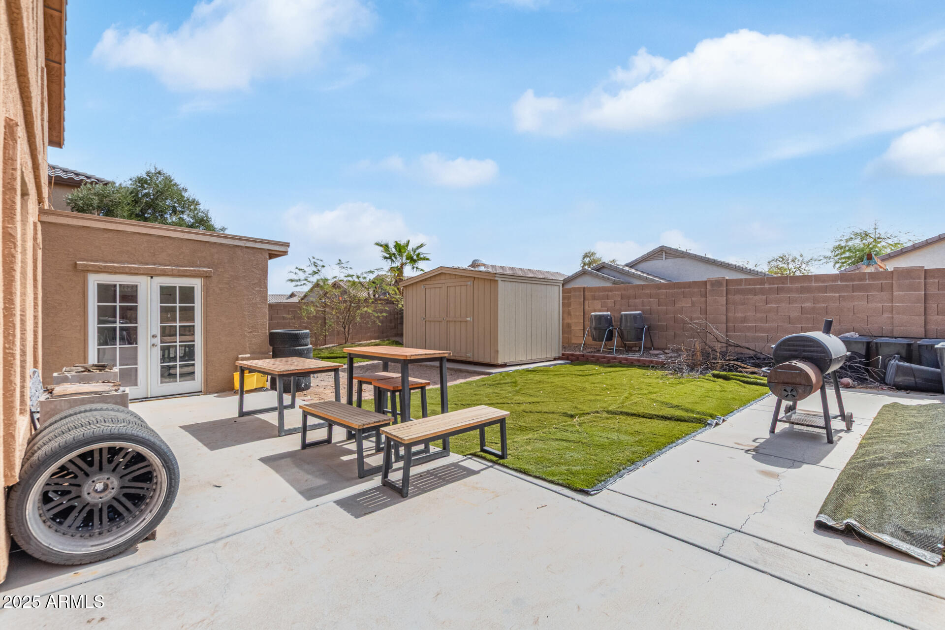 3209 West Apollo Road Phoenix, AZ 85041 - Photo 37 of 40 a view of a house with backyard and sitting area