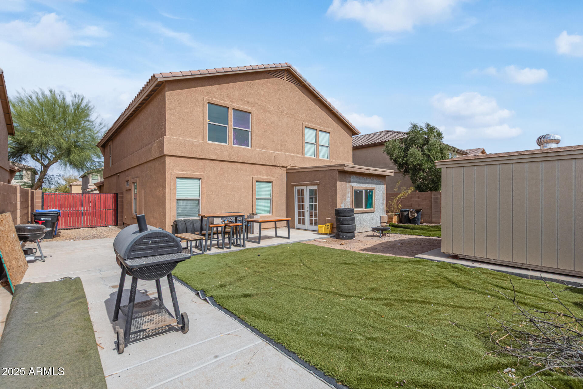 3209 West Apollo Road Phoenix, AZ 85041 - Photo 38 of 40 a view of a house with sitting area and a yard