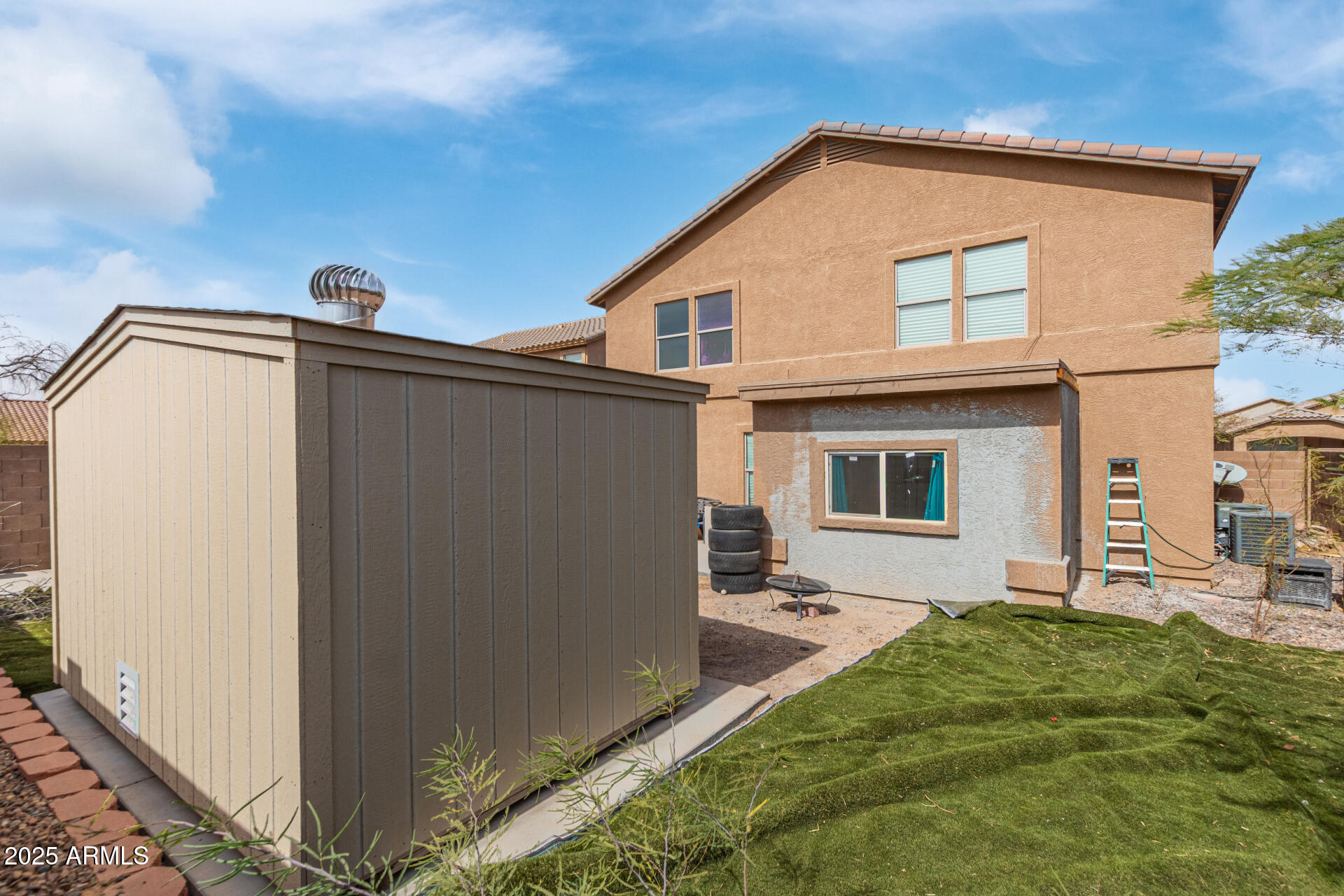 3209 West Apollo Road Phoenix, AZ 85041 - Photo 39 of 40 a front view of a house with garden