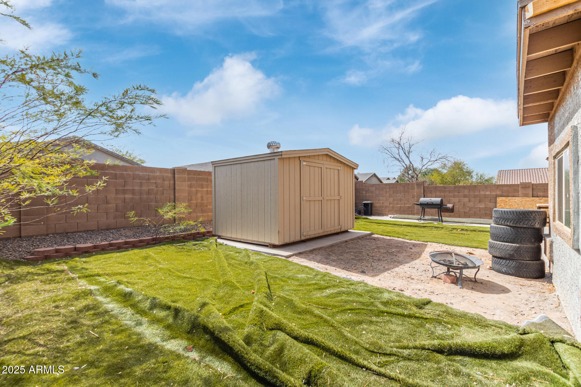 3209 West Apollo Road Phoenix, AZ 85041 - Photo 40 of 40 a view of a swimming pool with a yard