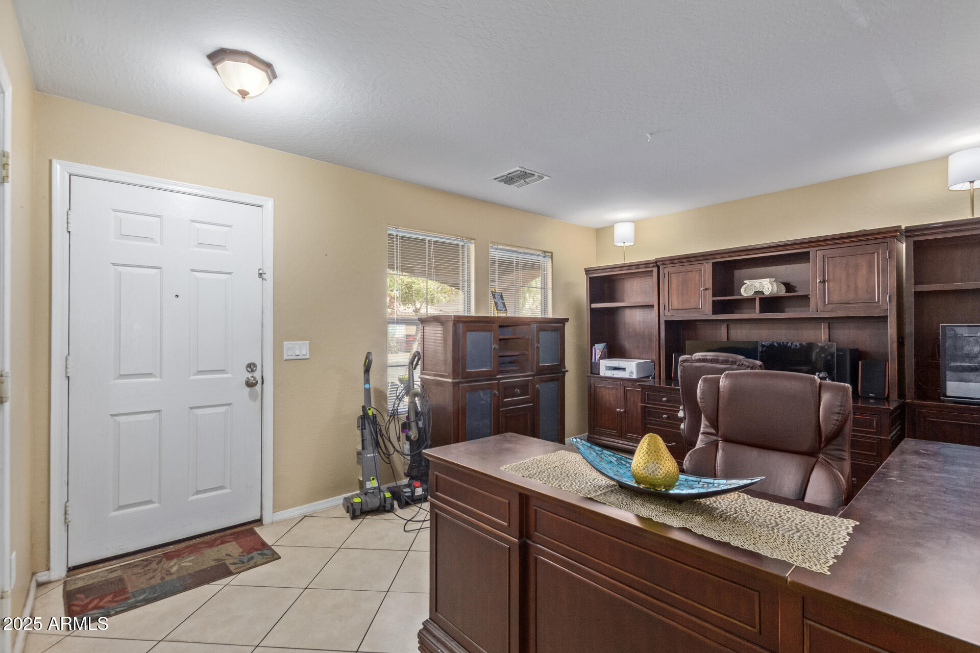 3209 West Apollo Road Phoenix, AZ 85041 - Photo 6 of 40 a kitchen with granite countertop a refrigerator and a sink