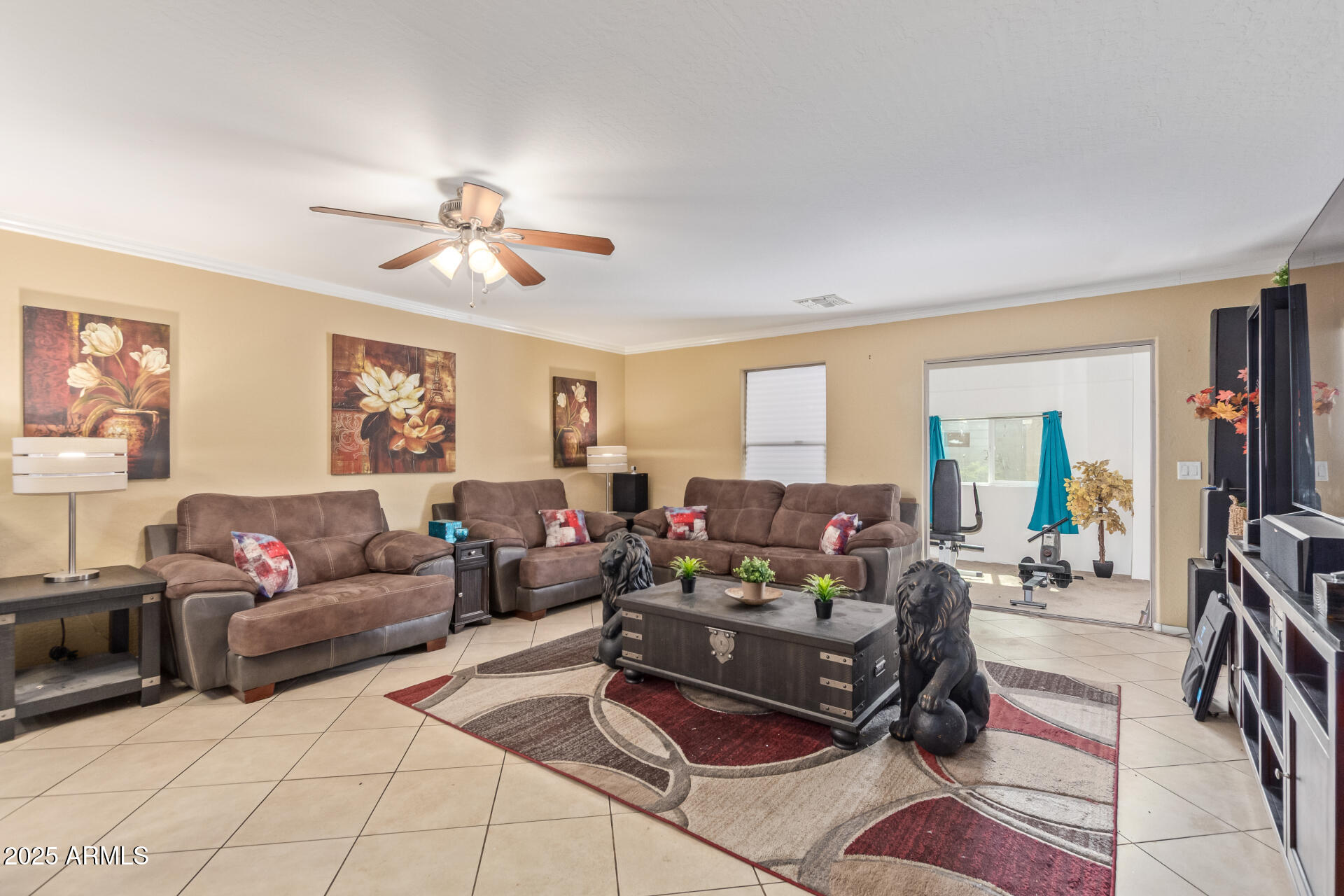 3209 West Apollo Road Phoenix, AZ 85041 - Photo 7 of 40 a living room with furniture and a chandelier