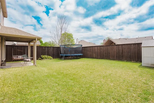 a swimming pool with wooden fence